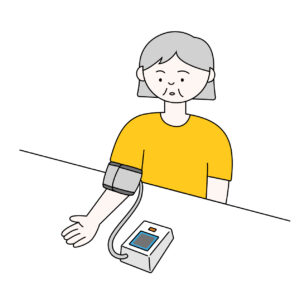 血圧を測る年配女性